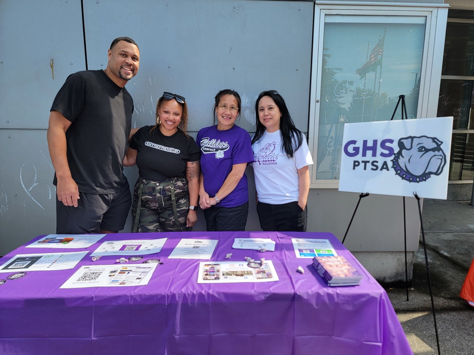 Marquita connecting with families at a school community table